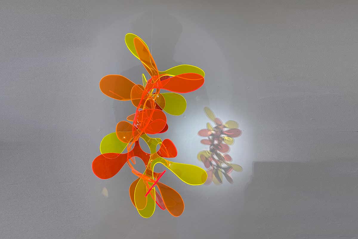 sculpture with oranic shapes and fluorescent colors